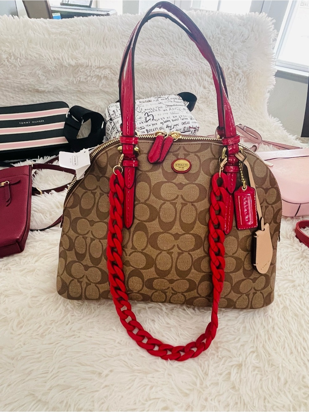 Beautiful Coach Signature peyton Dome Satchel with Red Acc and red Chain charm.